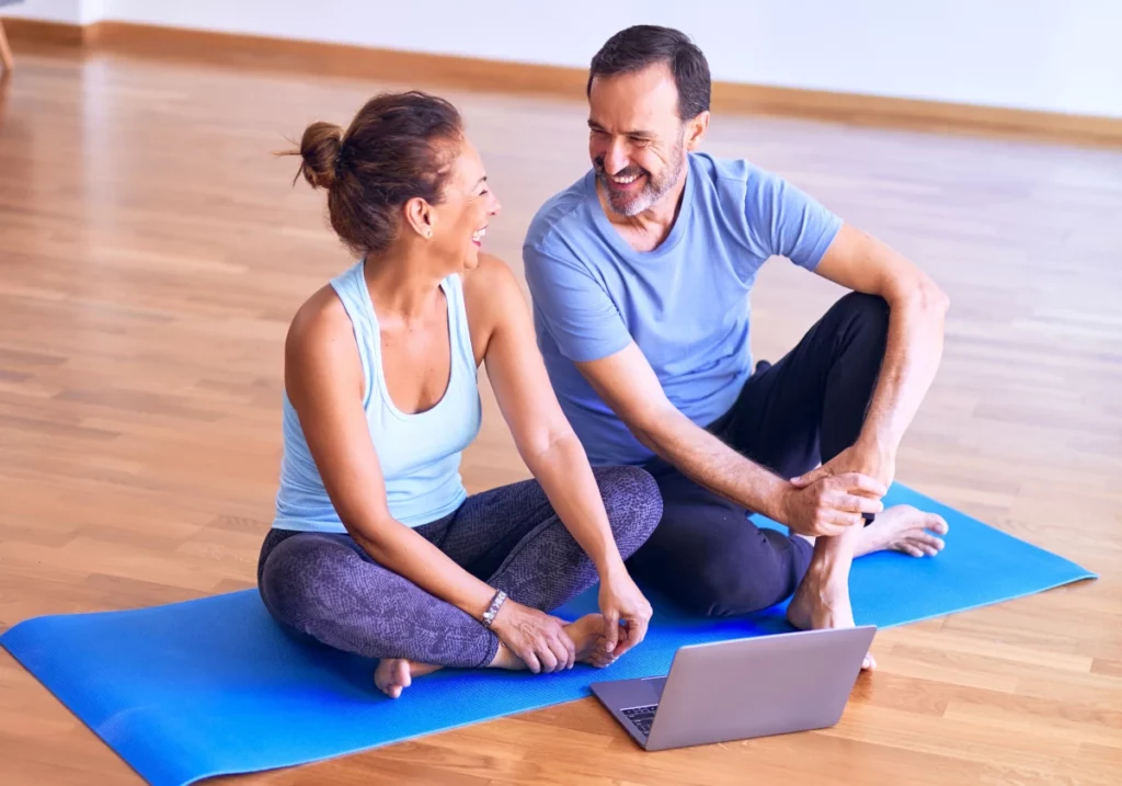 get into shape - couple on exercise mat